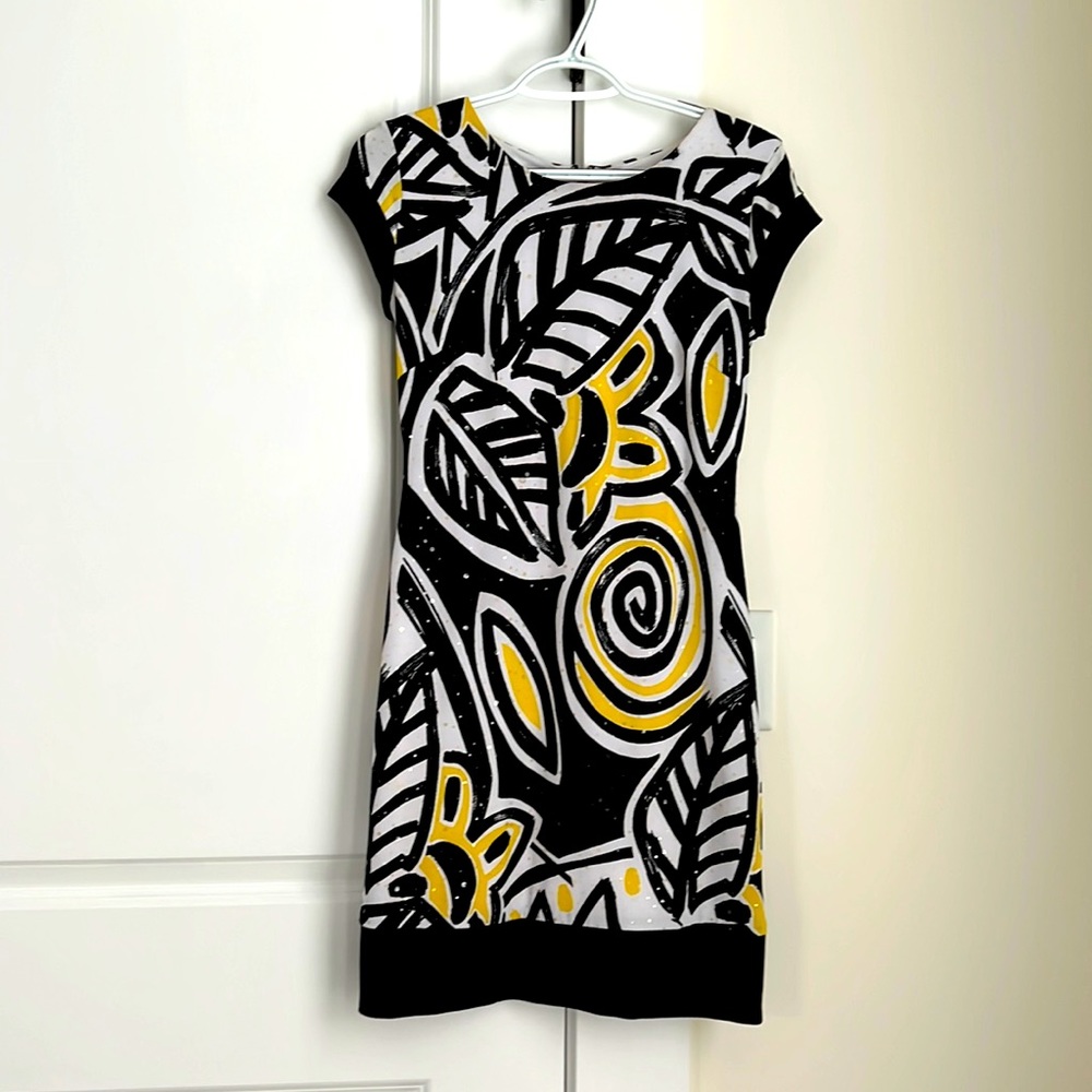 A dress Cache brand.   Is black, yellow and white.
